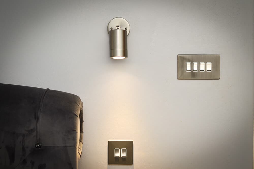 chrome-light-and-switches-in-bedroom